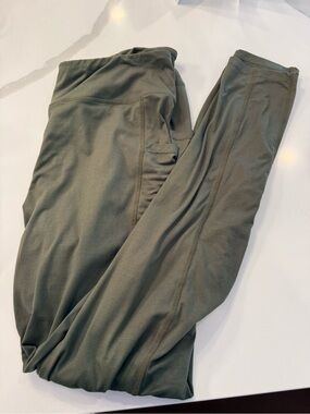 Green Satina Plus Size Soft Leggings. Polyester Blend. Pockets. Machine Wash.